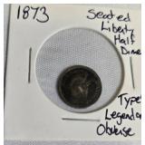 1873 Seated Liberty Half Dime Type 4, featuring a legend on the obverse side. 1873 Seated Liberty Half Dime Type 4, featuring a legend on the obverse side.