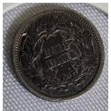 1873 Seated Liberty Half Dime Type 4, featuring a legend on the obverse side. 1873 Seated Liberty Half Dime Type 4, featuring a legend on the obverse side.