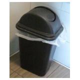 4 garbage cans and a wet floor sign 4 garbage cans and a wet floor sign