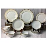 Limoges France Marshall Fields (M.F. & C.) Chicago Gold Encrusted Porcelain Dinnerware Set with Gold Trimmed Teacups and Saucers from O. & E. G. Royal Austria