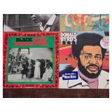 Jazz Vinyl Record Collection Featuring Miles Davis and John Coltrane