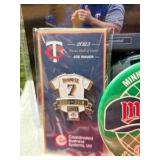 Minnesota Twins Memorabilia Package: 2010 Inaugural Season Mini Louisville Slugger, 2014 ALL-STAR Game Ball, Chewing Gum Tin Holder(2004), 2020 Towel Homer Hankie, & Joe Mauer Pin and Photo, & mini He