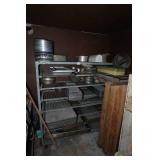 Industrial Rolling Shelf with Large Assortment of Cake and Bread Pans