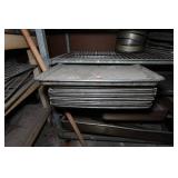 Industrial Rolling Shelf with Large Assortment of Cake and Bread Pans