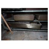 Industrial Rolling Shelf with Large Assortment of Cake and Bread Pans