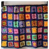 Vintage Crocheted Granny Square Afghan – Multicolor Floral Motifs on Navy Ground