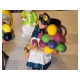 Ceramic Figurines and Decorative Items including Balloon Vendor Figures, Rabbit, and Easter Egg