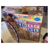 Disney Themed Toys and Accessories including Frozen Artwork, Mickey Mouse Plush Toys, and Water Bottles