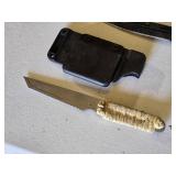 Lot of three knives including Smith & Wesson H.R.T., two other knives with paracord-wrapped handles, and sheaths