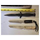 Lot of three knives including Smith & Wesson H.R.T., two other knives with paracord-wrapped handles, and sheaths
