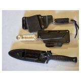 Lot of three knives including Smith & Wesson H.R.T., two other knives with paracord-wrapped handles, and sheaths