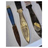 Throwing Knives including Oriental Mfg Knives, Blue Handle Knife, and Sheath
