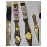 Throwing Knives including Oriental Mfg Knives, Blue Handle Knife, and Sheath