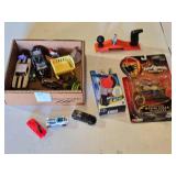 Box of Toy Cars and Power Rangers Items including Black & Decker Toy Plane, Beyblade Slingshot, Power Rangers Mystic Cycle Blasters, and Matchbox Cars