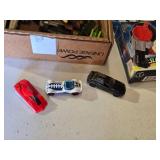 Box of Toy Cars and Power Rangers Items including Black & Decker Toy Plane, Beyblade Slingshot, Power Rangers Mystic Cycle Blasters, and Matchbox Cars
