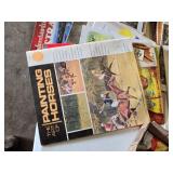 Art Supplies Lot including Paints, Brushes, and a Pile of Modern and Vintage Instructional Books