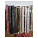 Ernie Ball Super Slinky Guitar Strings and Music CD Collection featuring artists like Kenny G, Andrea Bocelli, and Santana.