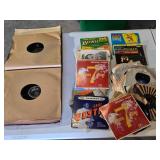 Collection of Vintage Vinyl Records and Sleeves including titles like "Number 7 Theme" by Mitchell Ayres and "Hawaii Calls." The lot also contains empty record sleeves featuring various artists and th