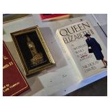 Books about British royalty and landmarks including "London: A Photographic Journey" by Benny Green, "The Tower of London", and "Queen Elizabeth II: A Woman Who Is Not Amused" by Nicholas Davies