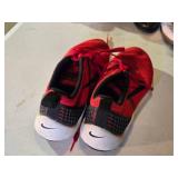 Nike Size 9.5 Red Athletic Shoes with Black Swoosh Logo