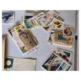 Collection of Vintage and Modern U.S. Postage Stamps Some Unmarked, Pile of Used