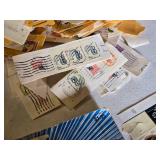 Collection of Vintage and Modern U.S. Postage Stamps Some Unmarked, Pile of Used