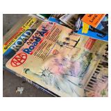 Collection of Maps and Travel Guides Including AAA Road Atlases and Oslo Travel Guides Assortment of travel-related books and maps featuring various destinations including Wales, Louisiana, and Scandi