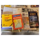 Collection of Maps and Travel Guides Including AAA Road Atlases and Oslo Travel Guides Assortment of travel-related books and maps featuring various destinations including Wales, Louisiana, and Scandi