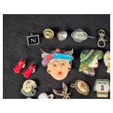 Lot of Assorted Brooches and Pins featuring themes like Operation Desert Storm, sports teams, and novelty designs.