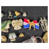 Lot of Assorted Brooches and Pins featuring themes like Operation Desert Storm, sports teams, and novelty designs.