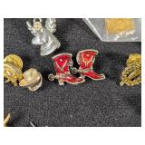 Lot of Assorted Brooches and Pins featuring themes like Operation Desert Storm, sports teams, and novelty designs.