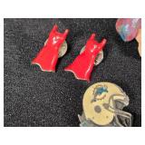 Lot of Assorted Brooches and Pins featuring themes like Operation Desert Storm, sports teams, and novelty designs.