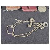 Assorted Vintage Collectibles including Liberty Bell Belt Buckle, Cadillac Emblem, and Leather Key Pouches