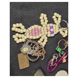 Large Lot of Assorted Keychains and Accessories featuring unique designs such as a beaded lizard, miniature license plates, and themed items from Las Vegas.