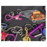 Large Lot of Assorted Keychains and Accessories featuring unique designs such as a beaded lizard, miniature license plates, and themed items from Las Vegas.