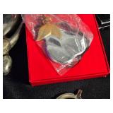 Assorted Household and Decorative Items including Coca-Cola Labels, Crystal Heart Trinket, and Butterfly Hair Clips