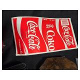 Assorted Household and Decorative Items including Coca-Cola Labels, Crystal Heart Trinket, and Butterfly Hair Clips