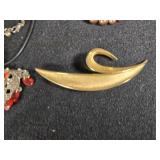 Lot of Costume Jewelry including Beaded Necklace, Gold Brooch, and Decorative Belt