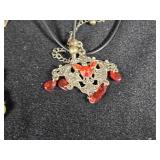 Lot of Costume Jewelry including Beaded Necklace, Gold Brooch, and Decorative Belt