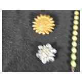 Lot of Costume Jewelry including Beaded Necklace, Gold Brooch, and Decorative Belt