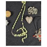 Lot of Costume Jewelry including Beaded Necklace, Gold Brooch, and Decorative Belt