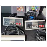 Nintendo NES-001 Entertainment System with 4 Controllers, 2 Cartridges, AV Cables & RF Modulator