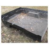 Rugged Liner branded truck bed line...