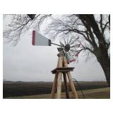 Windmill on a rustic wood stand...