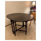Oval Drop-Leaf Dining Table - Dark Wood, 34 in Diameter, Turned Legs