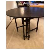 Oval Drop-Leaf Dining Table - Dark Wood, 34 in Diameter, Turned Legs