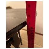 Oval Drop-Leaf Dining Table - Dark Wood, 34 in Diameter, Turned Legs