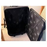Black Rolling Suitcase with Front Zip Pockets and Star-Pattern Interior