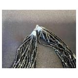 Hanging Jewelry Organizer with Clear Pockets - Includes 3 Beaded Necklaces