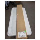 Long Rectangular Cardboard Box with White Shipping Label - Warehouse Item
